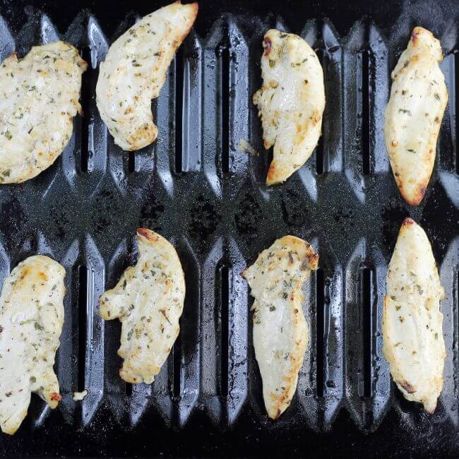 Simple broiled chicken tenders on a broil pan.