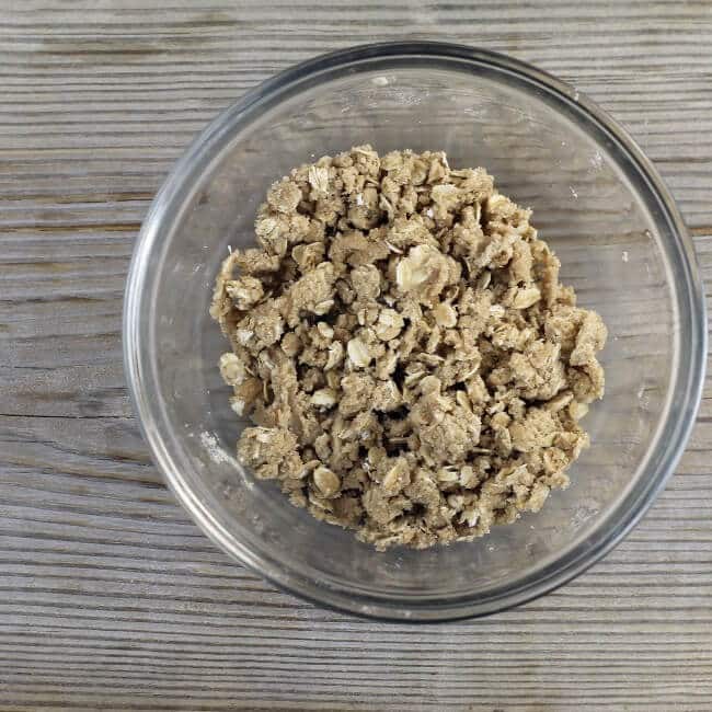 Brown sugar oats crumble in a small mixing bowl.
