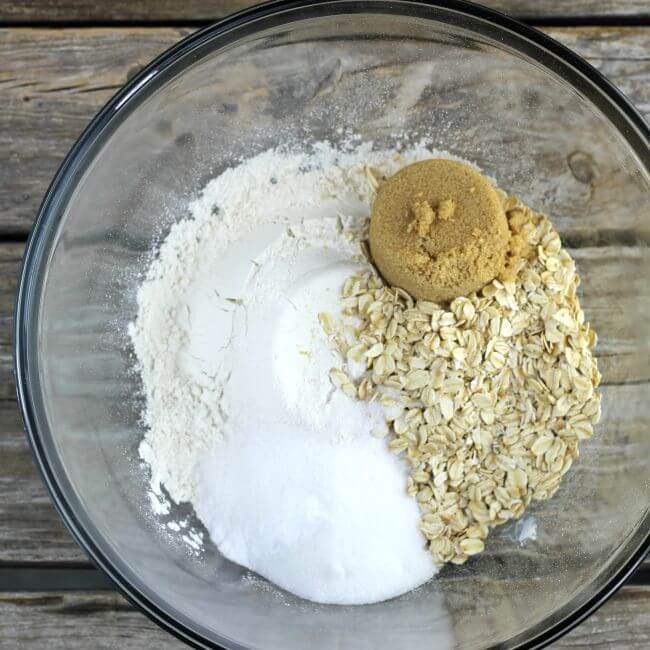 flour, oats, and sugar in a glass bowl