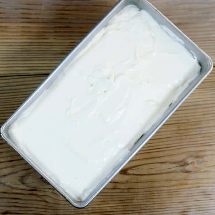 The cream mixture is added to a loaf pan.