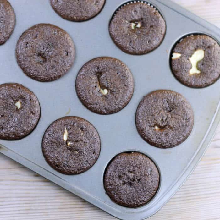 Baked cupcakes in a muffin tin.