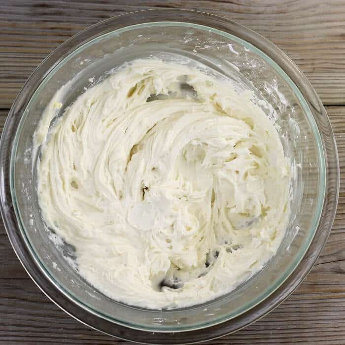 Frosting in a glass mixing bowl.