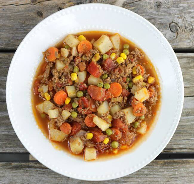 Over head view of easy hamburger stew in a white bowl