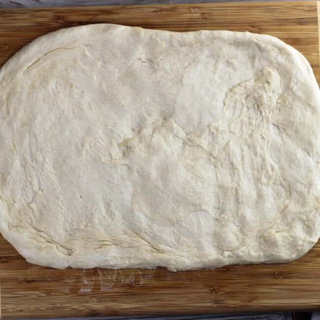 Dough is roll out into a rectangle. 