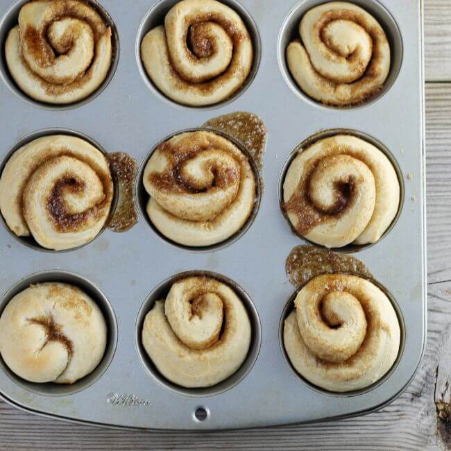 Muffin tins full of rolls.