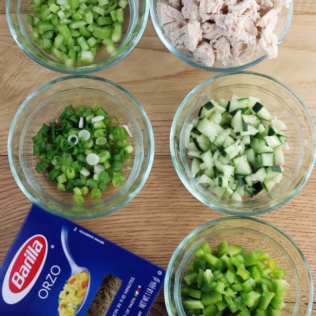 Looking down at ingredients for pasta chicken salad.