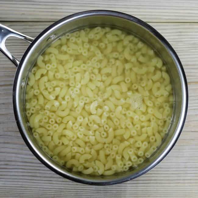 Elbow macaroni in a large saucepan.