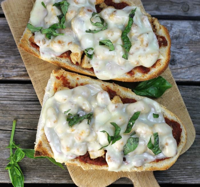 Chicken Parmesan French Bread Pizza a simple delicious pizza ready in under 30 minutes that combines chicken parmesan and pizza all into one.