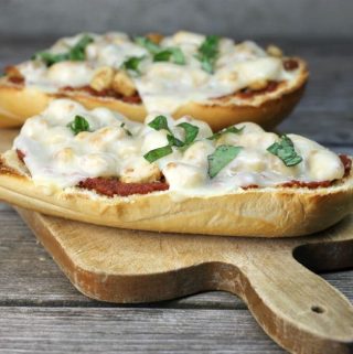 Chicken Parmesan French Bread Pizza a simple delicious pizza ready in under 30 minutes that combines chicken parmesan and pizza all into one.