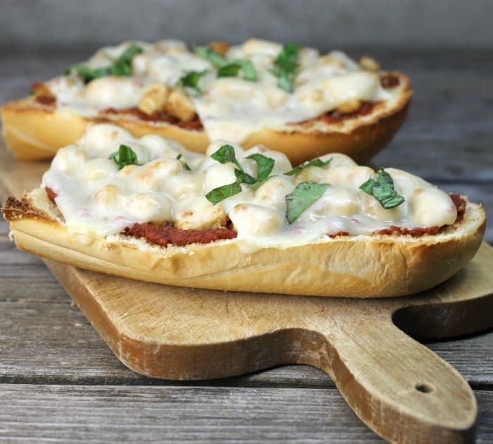 Chicken Parmesan French Bread Pizza a simple delicious pizza ready in under 30 minutes that combines chicken parmesan and pizza all into one.