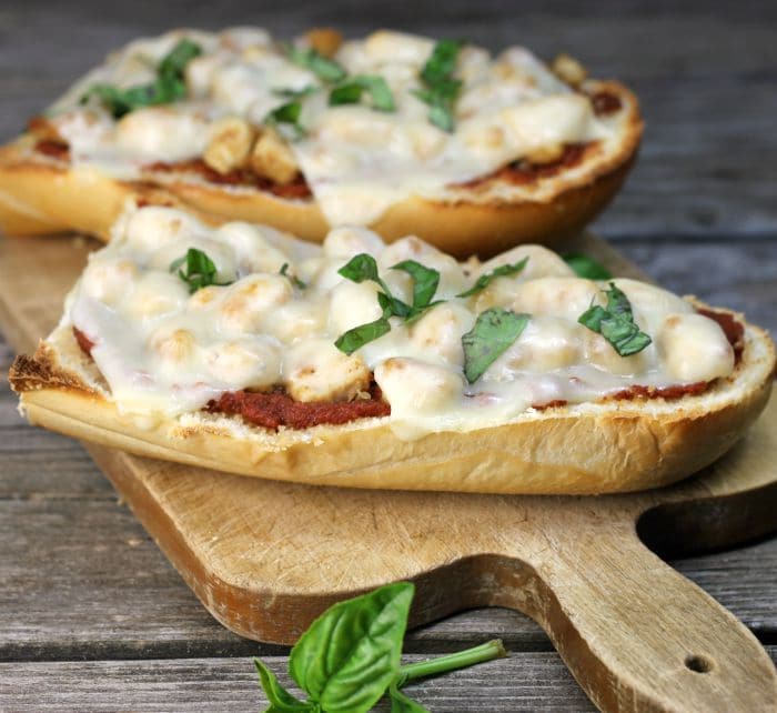 Chicken Parmesan French Bread Pizza a simple delicious pizza ready in under 30 minutes that combines chicken parmesan and pizza all into one.