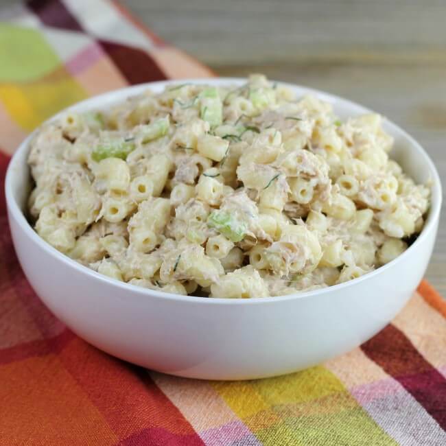 A side angle view of a bowl of macaroni salad.