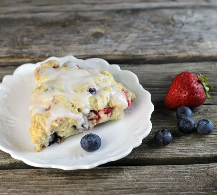 Mixed berry scones are filled with strawberries and blueberries a great way to start your morning off.