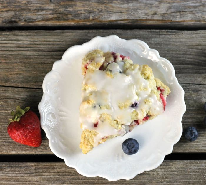 Mixed berry scones are filled with strawberries and blueberries a great way to start your morning off.