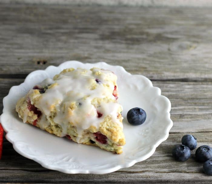 Mixed berry scones are filled with strawberries and blueberries a great way to start your morning off.