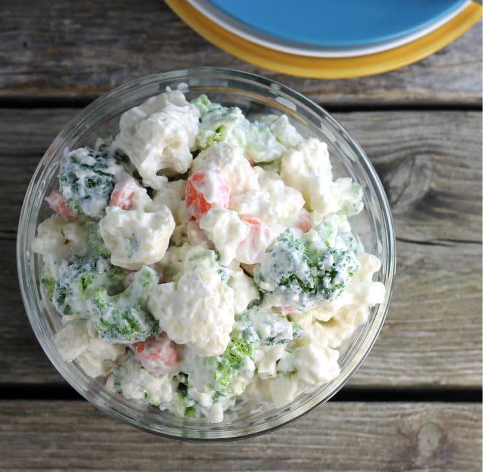 Cauliflower Broccoli Salad is a cold side salad that is covered in a creamy dressing and is a great side dish to make for a large group.