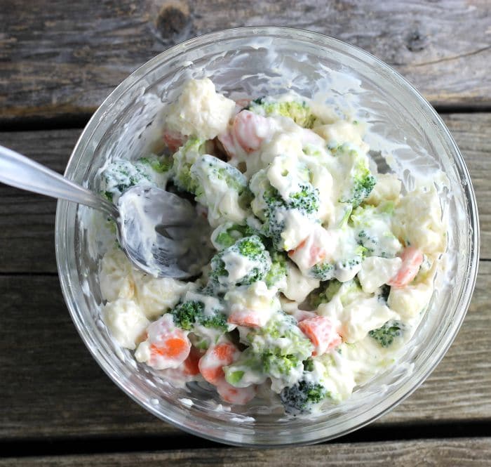 Cauliflower Broccoli Salad is a cold side salad that is covered in a creamy dressing and is a great side dish to make for a large group.