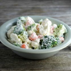 Cauliflower Broccoli Salad is a cold side salad that is covered in a creamy dressing and is a great side dish to make for a large group.