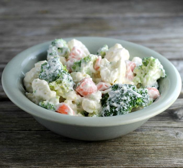 Cauliflower Broccoli Salad is a cold side salad that is covered in a creamy dressing and is a great side dish to make for a large group.