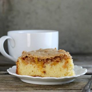 Fresh peach coffee cake is a soft moist cake topped with fresh peaches, crumble topping and icing. It is great to make on lazy Sunday mornings.