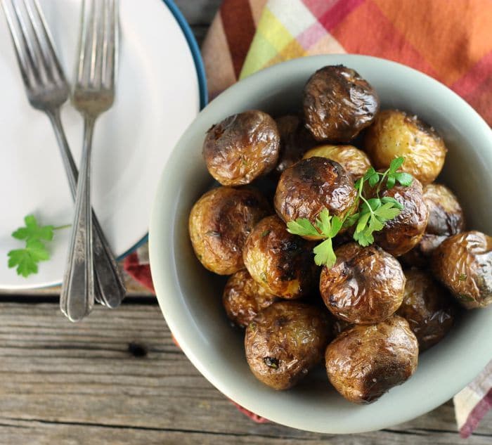 Oven roasted baby potatoes are left whole for roasting. I love the small potatoes, not only are they cute but they are tasty too.