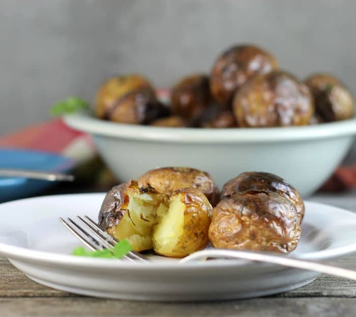 Oven roasted baby potatoes are left whole for roasting. I love the small potatoes, not only are they cute but they are tasty too.