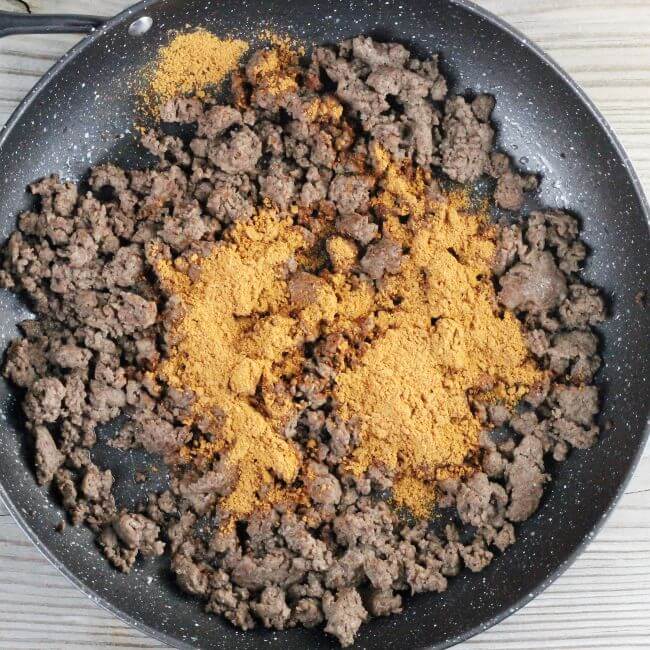Taco seasoning is added to the ground beef.
