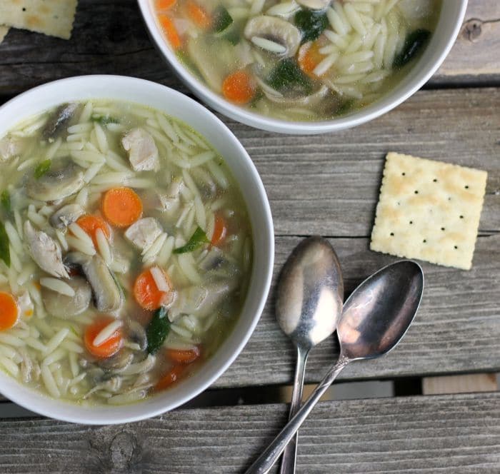 Chicken orzo soup a simple soup with great flavor made with cooked chicken, orzo, carrots, mushrooms, and spinach total comfort food.