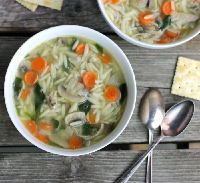 Chicken orzo soup a simple soup with great flavor made with cooked chicken, orzo, carrots, mushrooms, and spinach total comfort food.