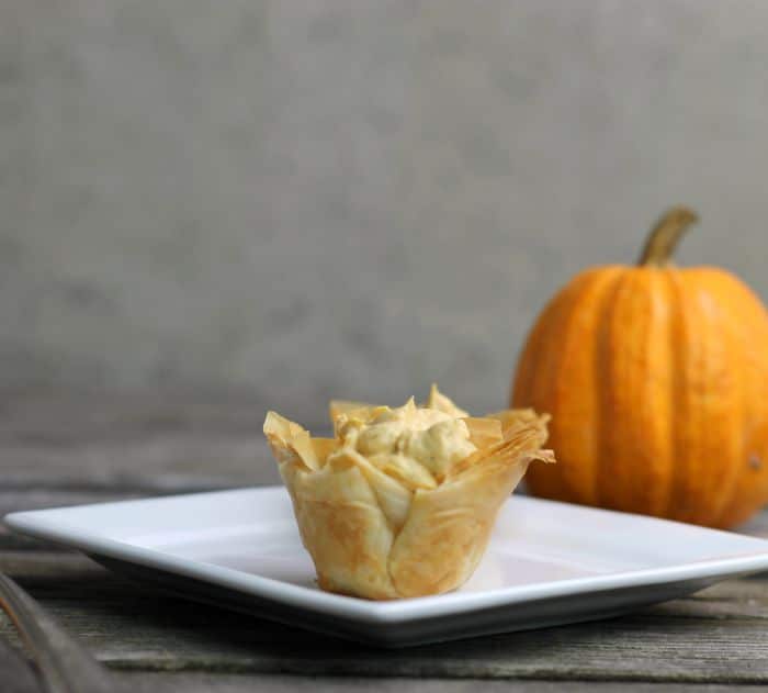 Mini Pumpkin Pie Tarts have a crispy phyllo shell and a no-bake pumpkin cream cheese filling perfect for the holiday season.