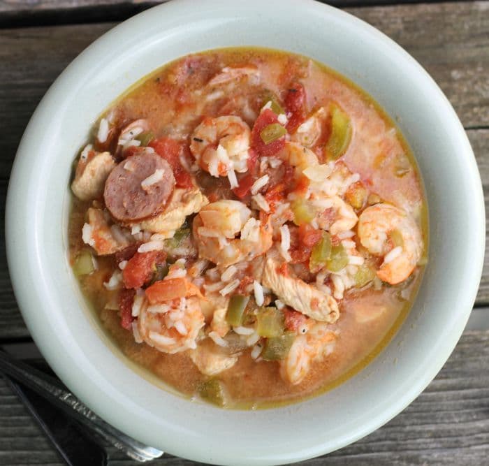 Easy Slow Cooker Gumbo is super easy to make in the slow cooker and is loaded with chicken, sausage, and shrimp and spices; and a real crowd pleaser.