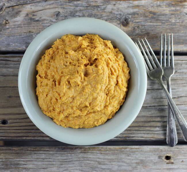 Looking down at a bowl of mashed sweet potatoes.