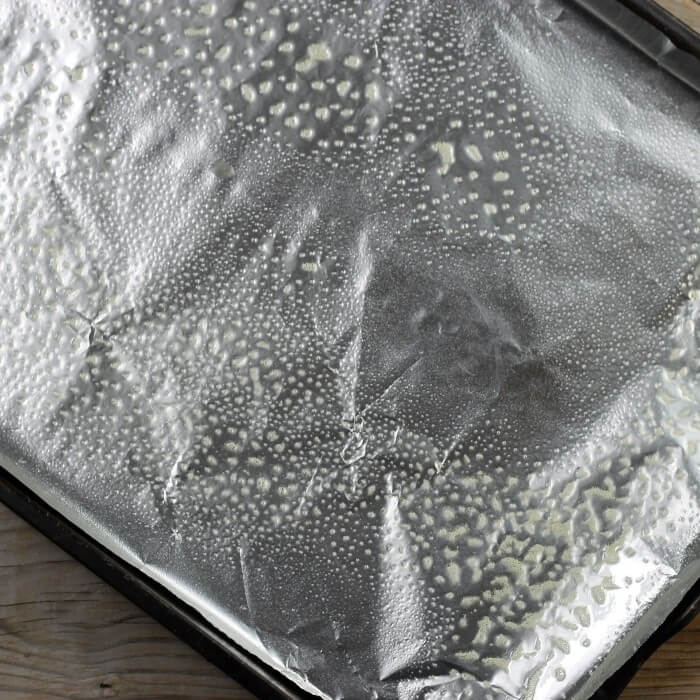 Aluminum foiled lined baking pan with no-stick spray on it.