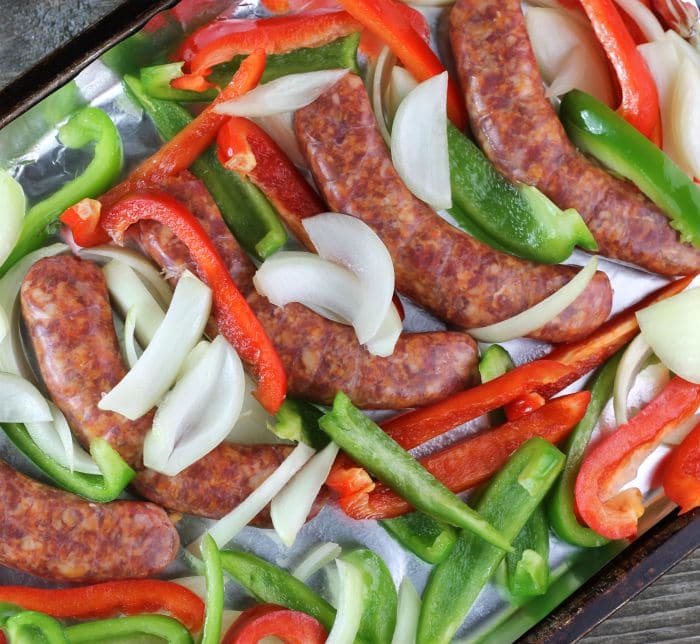 Baked Italian Sausage and Peppers all baked together on a baking sheet, it is ready in under an hour and is perfect for any day of the week.