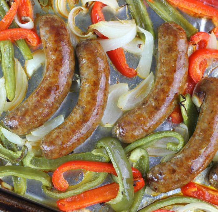 Baked Italian Sausage and Peppers all baked together on a baking sheet, it is ready in under an hour and is perfect for any day of the week.