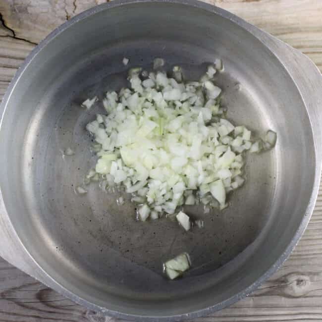 Chopped onion in a Dutch oven.