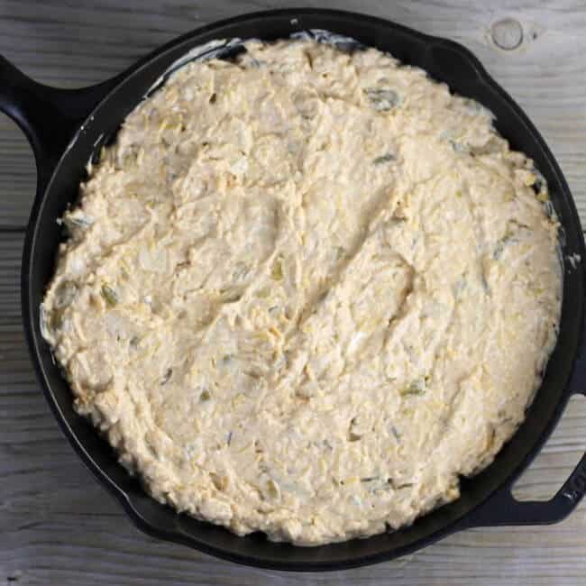 The dip is spread in to a skillet for baking. 