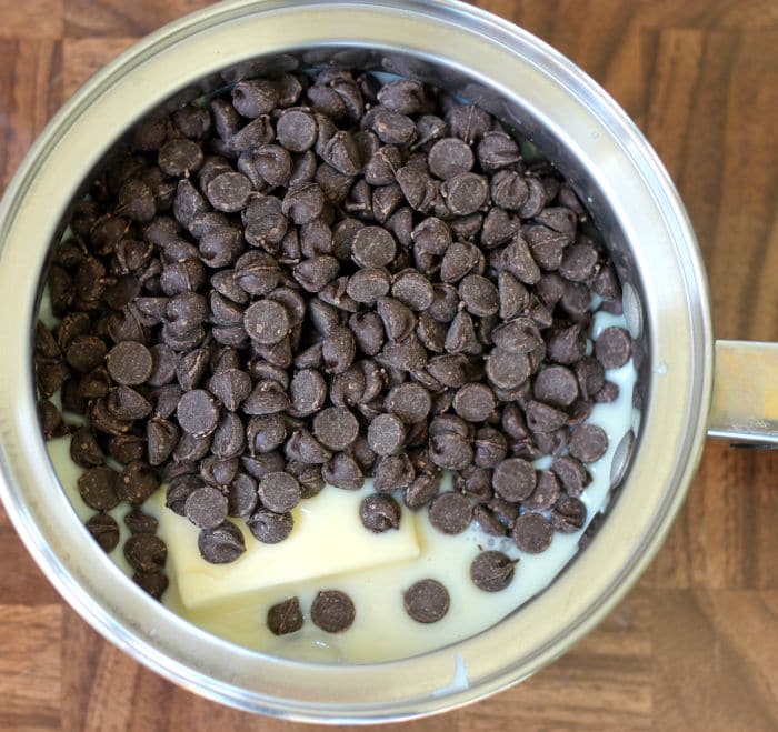 chocolate chips, butter, and sweetened condensed millk in pan