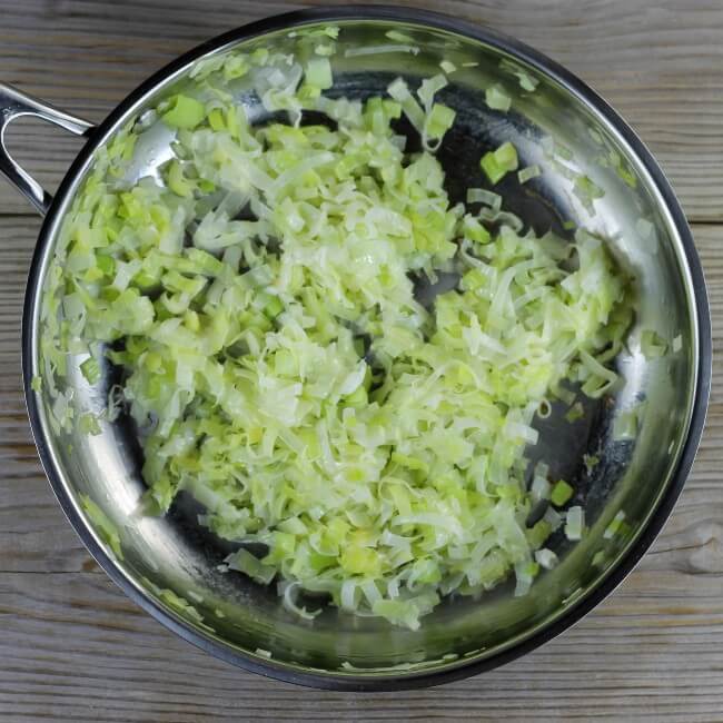 Cooked leeks in a skillet. 
