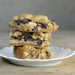 A side view of a plate of peanut butter bars.