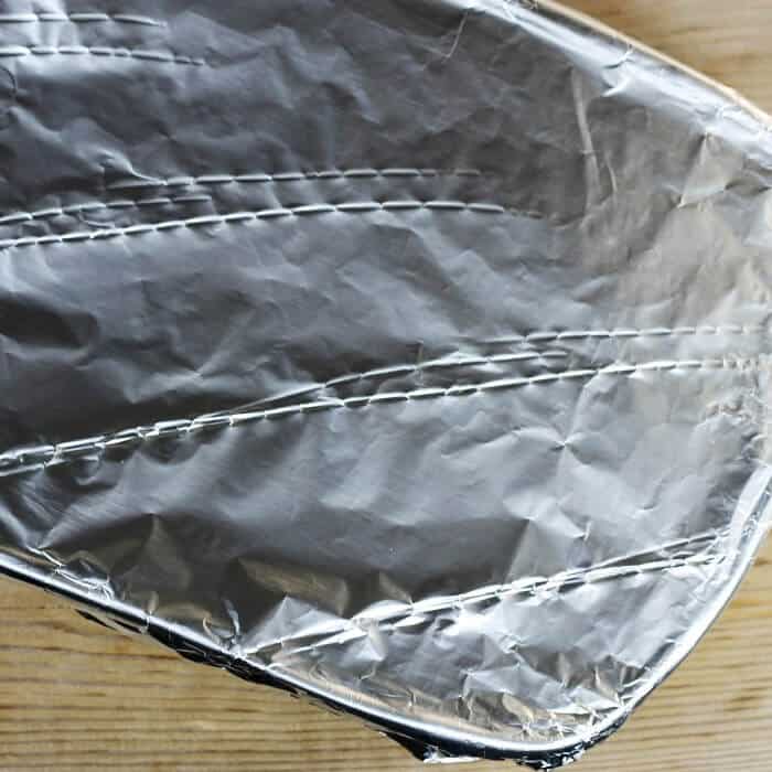 A baking dish covered with aluminum foil