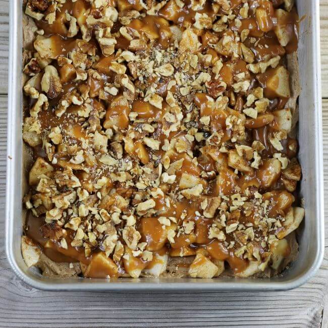 Unbaked apple bars in a baking pan.