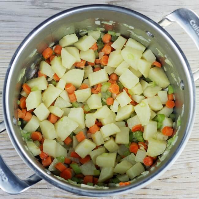Cooked vegetables in a large pot.