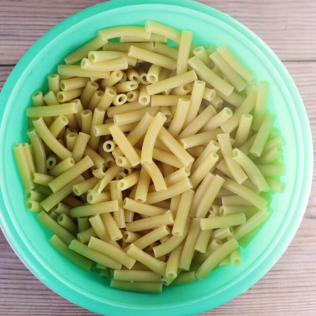 Noodles in a green bowl.
