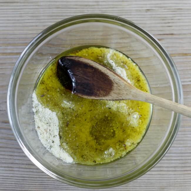Olive oil is added to dry ingredients. 