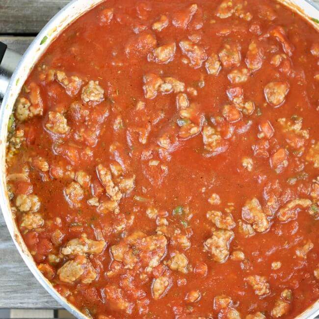 Italian sausage and tomato sauce in a skillet