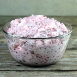 Cranberry fluff salad in a glass bowl.
