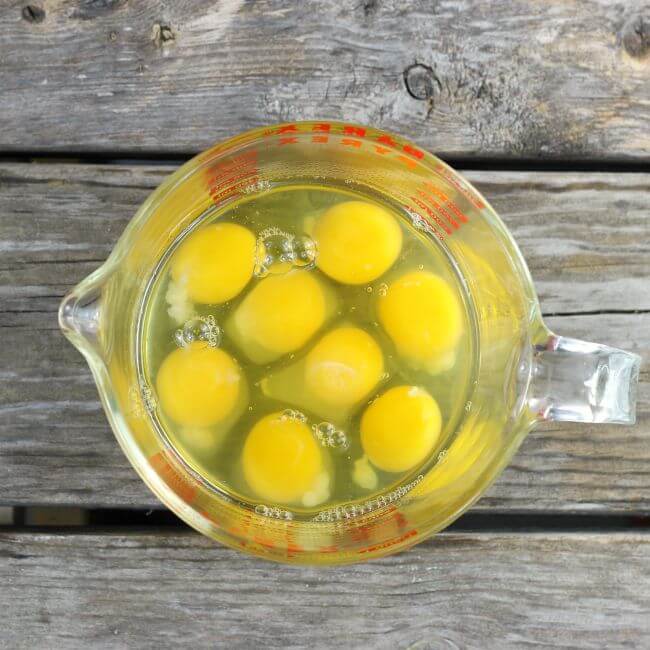 Eggs in a glass measuring cup.