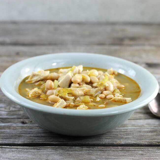 White chicken chili in a green bowl.