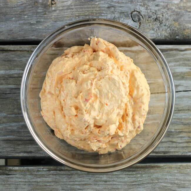 Roasted red pepper spread in a glass bowl.